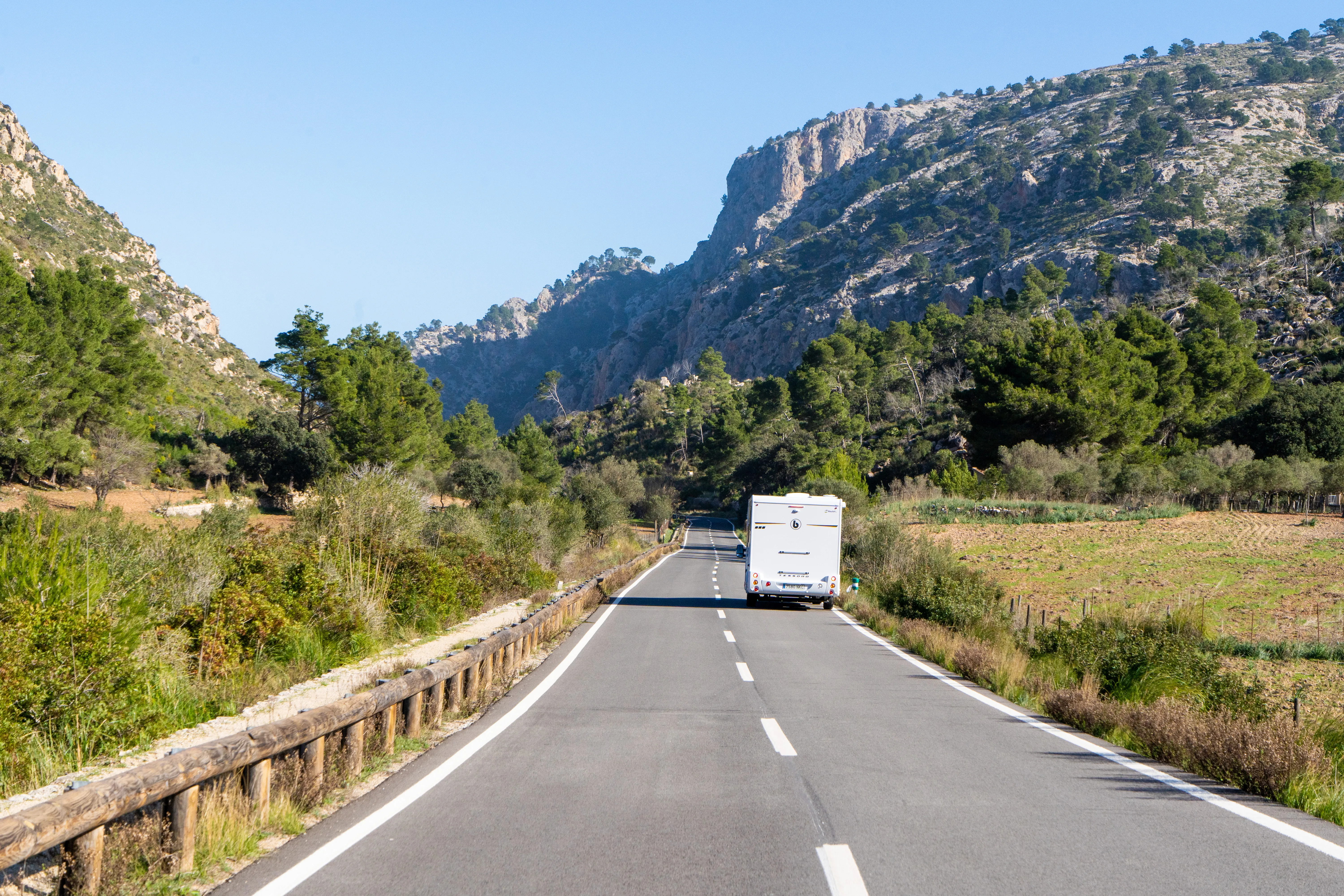 Campervan on road with Mallorca mountains in the background